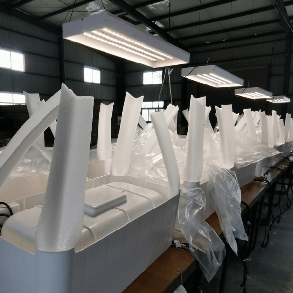 Production process of vertical hydroponic planting systems in a factory setting.